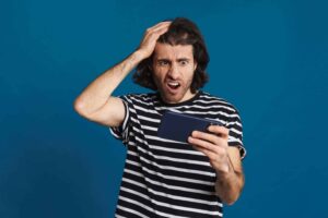 Article_02_confused_looking_at_cell_phone